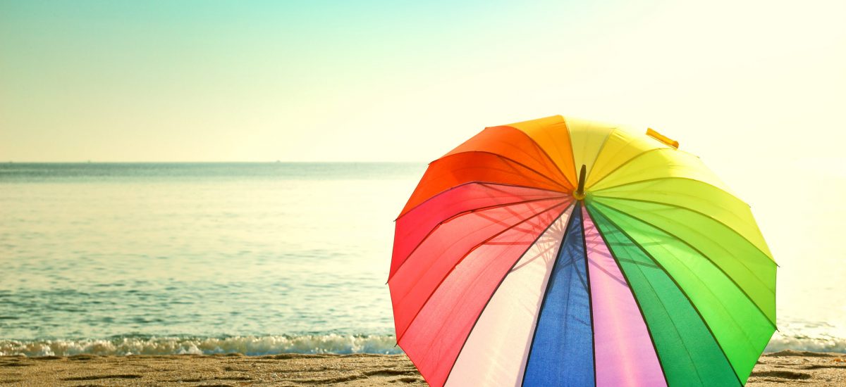 Colourful umbrella on the beach retro style